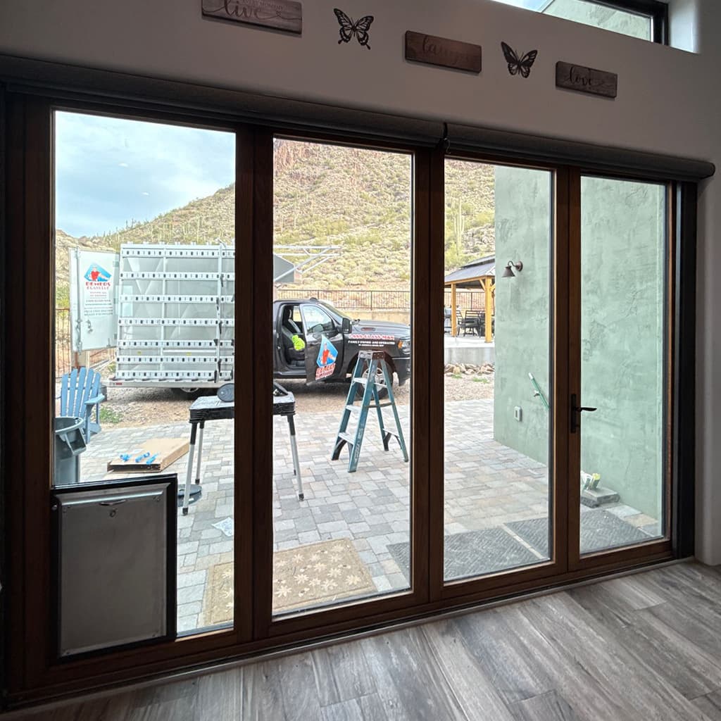 Multi-panel glass doors with dark frames