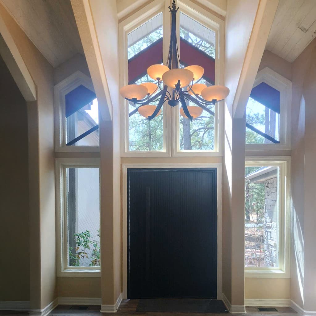 Tall front-entry glass with arched accents