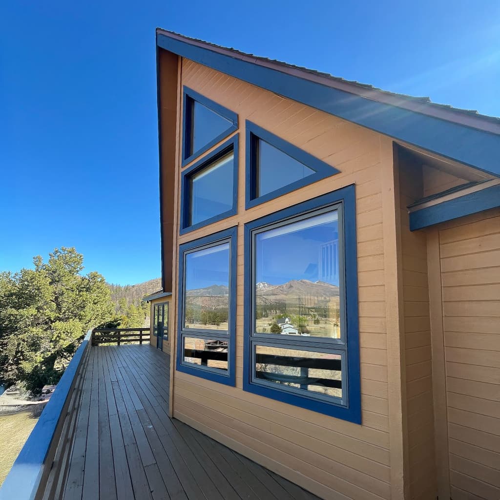 Multi-pane window wall with mountain views