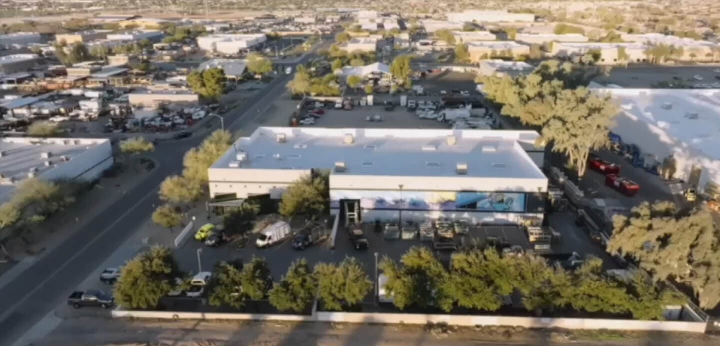 drone shot of Demers glass store front