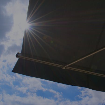 solar-powered retractable window awning