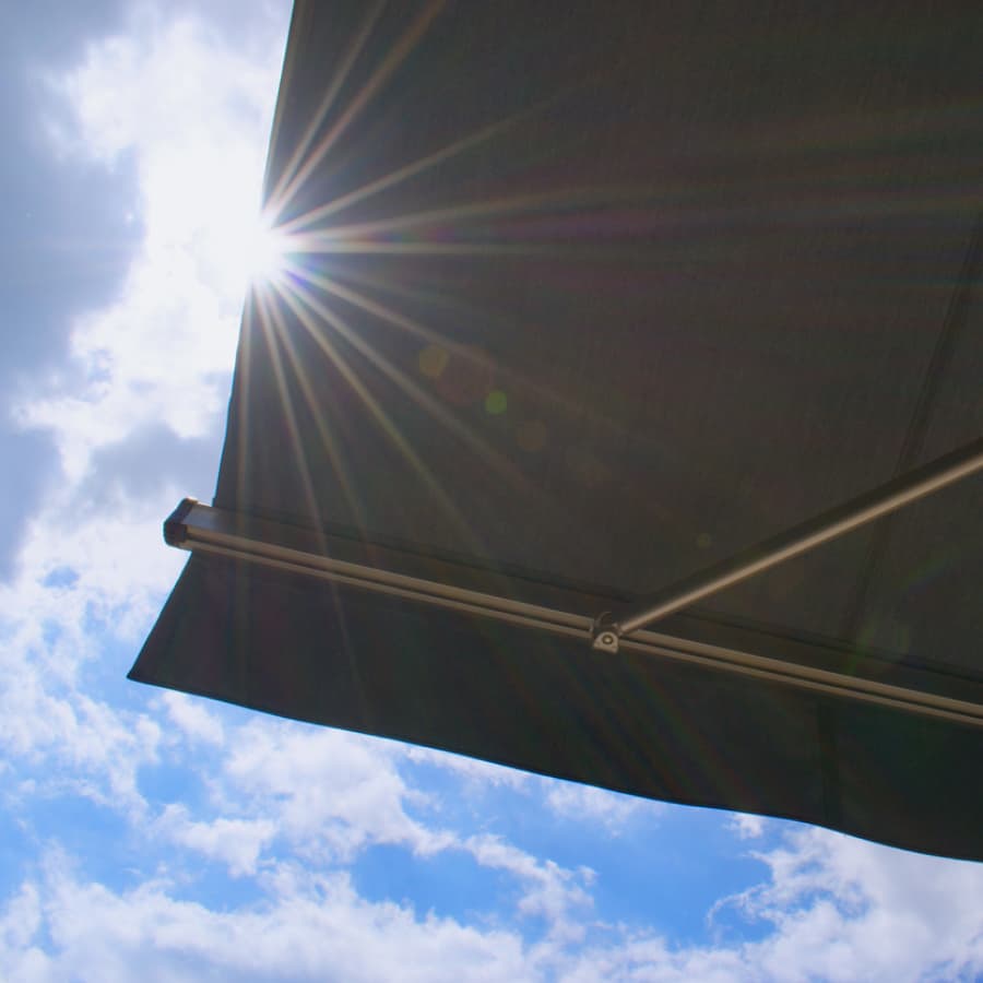 solar-powered retractable window awning