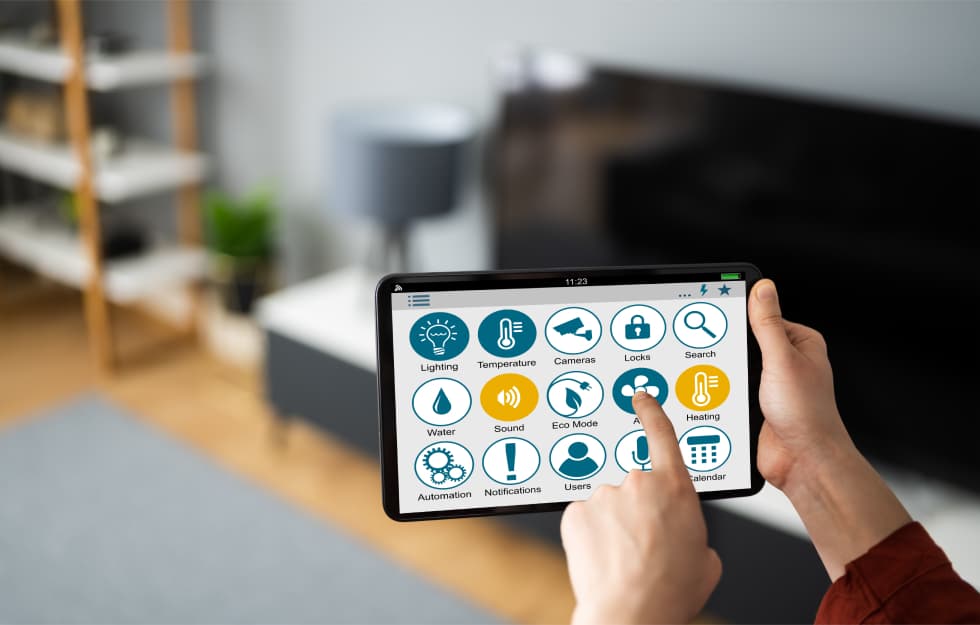 Someone controlling their smart home from a tablet